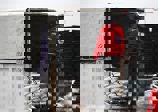 Aid convoy enters besieged, starving Syrian town