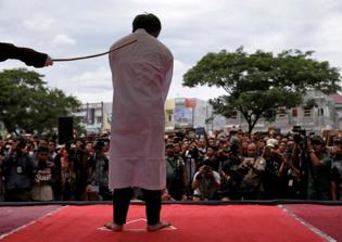 Christian publicly flogged in Indonesia's Aceh province for selling sharia-banned alcohol