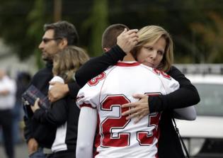 Football Team Gives Seattle High School League Trophy Following Shooting