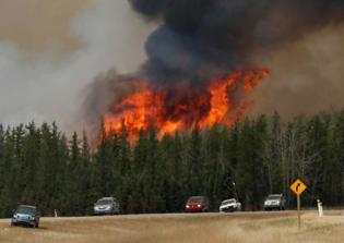 Syrian refugees pitch in to help wildfire victims in Canada