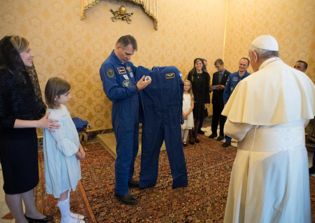 Astronauts give Pope Francis a custom-made spacesuit with white cape