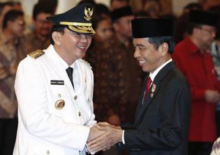 Jakarta governor Ahok tearful at blasphemy trial, denies insulting Quran