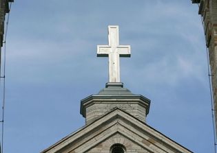 Pastor discovers burning cross outside African-American church in Texas