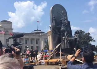 Satanists protest Ten Commandments monument at Arkansas State Capitol with giant goat-headed statue