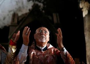 Iraqi Christians weep as they return to church desecrated by ISIS